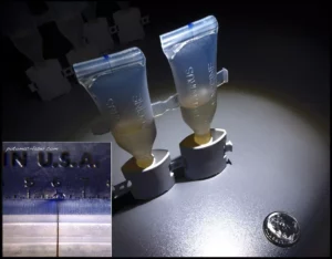 10 micron diameter leak test holes.