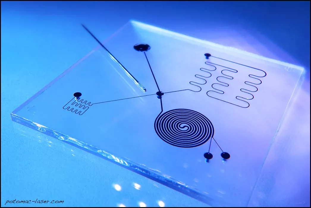 Microfluidic device with hot-embossed spiral pattern